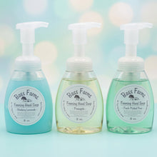 Load image into Gallery viewer, A set of foaming hand soap bottles in various colors with pumps, displayed on a shelf.