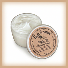 Load image into Gallery viewer, An open clear plastic jar of Bass & Farms Triple B Hydrating Cream showing the thick white cream inside, with the matching clear lid leaning in front displaying a brown kraft paper label.