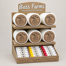 Load image into Gallery viewer, Bass Farms product display with various items on a blue background
