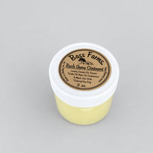Load image into Gallery viewer, A jar of Rash Away Ointment by Bass Farms, placed on a wooden surface.