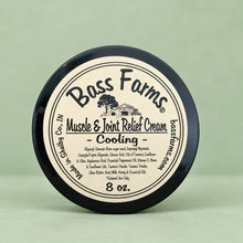 Load image into Gallery viewer, A jar of Muscle & Joint-Relief Cream with a label that includes the brand name and product description.