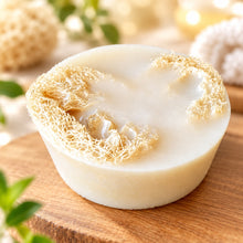 Load image into Gallery viewer, A bar of goat milk soap with a loofah attached to it