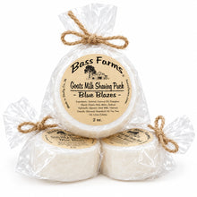 Load image into Gallery viewer, Packaged shaving puck in a bowl with natural ingredients visible through the transparent wrapping.